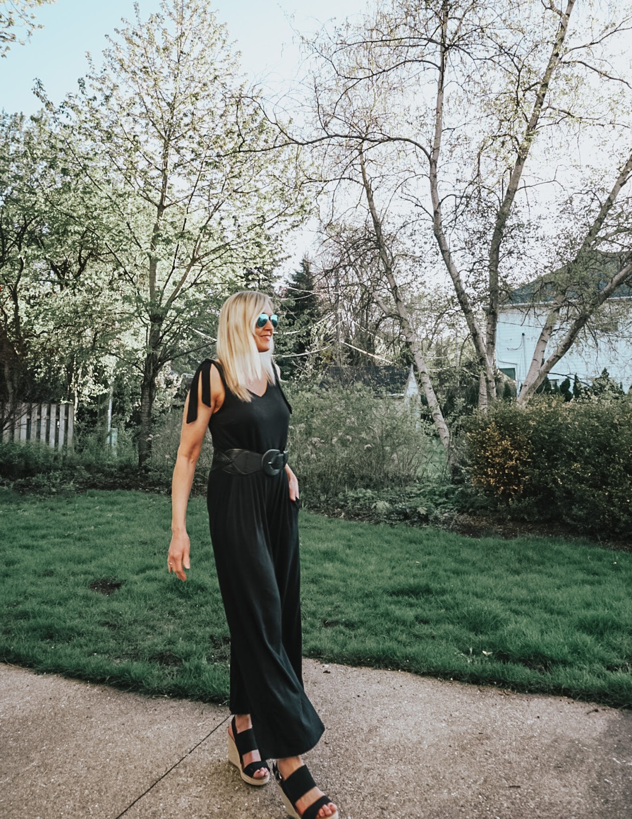 How to Style a Black Jumpsuit Spring Summer Doused in Pink